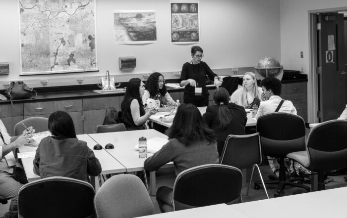 A group of students sitting at tables in a STEM laboratory classroom