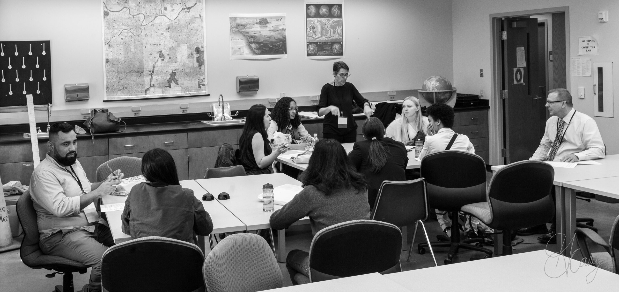 A group of students sitting at tables in a STEM laboratory classroom